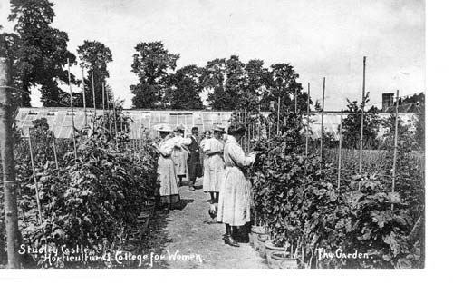 Tutor and students in garden. 1910